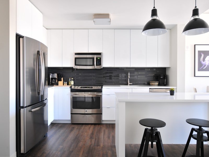 Modern kitchen with a large granite island — full waterfall fabrication by Montreal Granite