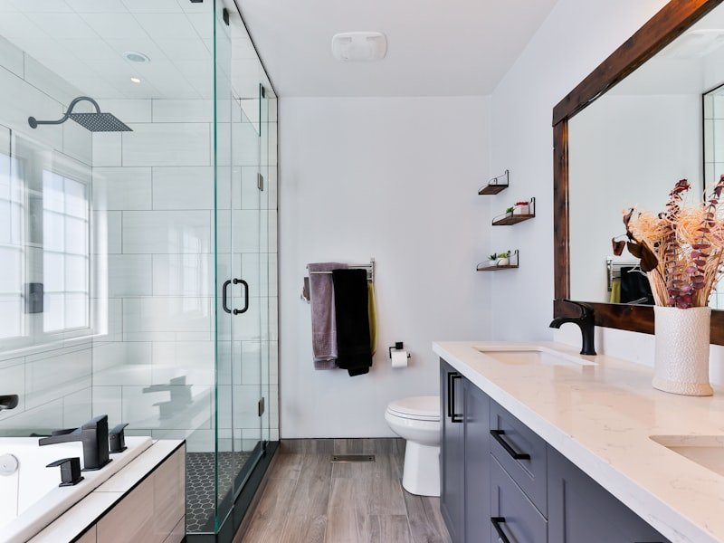 Bathroom vanity with stone countertop and modern faucet — granite bathroom vanity fabrication by Montreal Granite